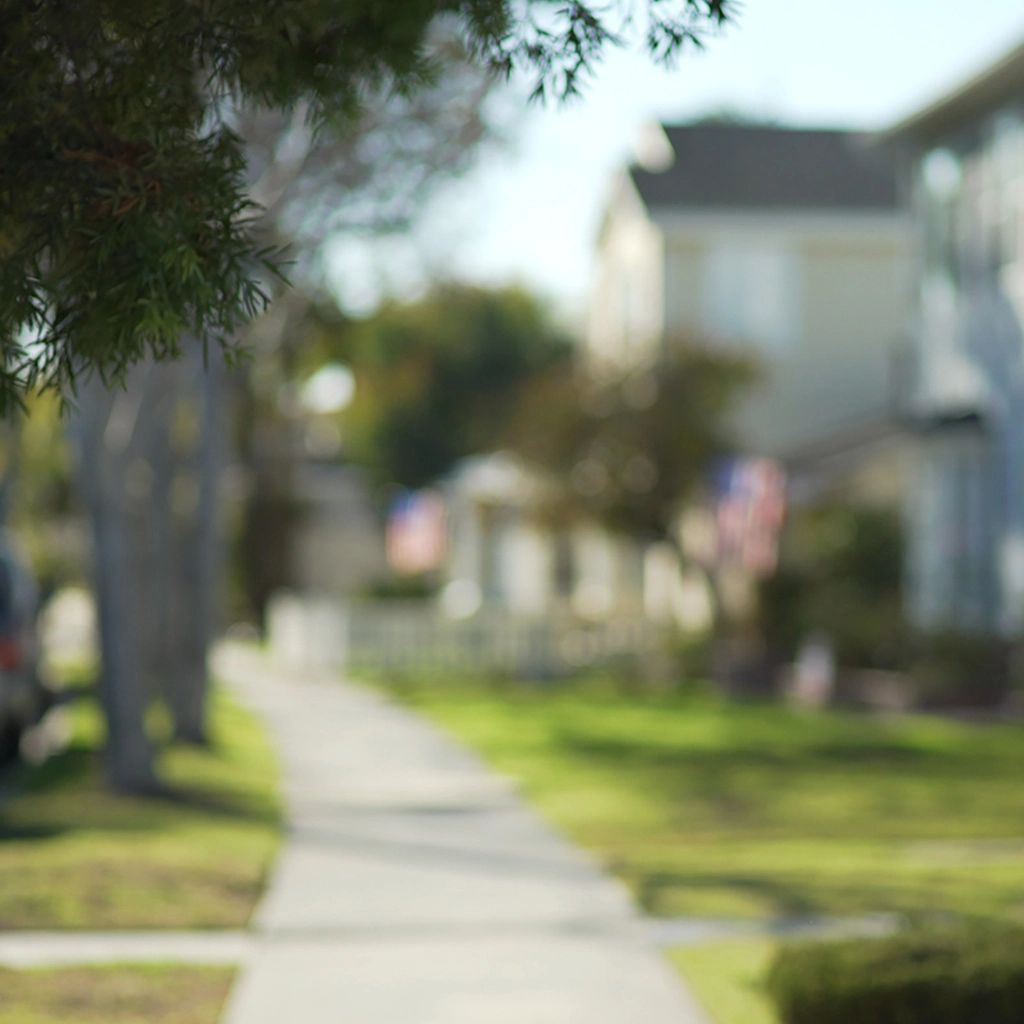 Blurred sidewalk view of a neighborhood in Dublin, OH.