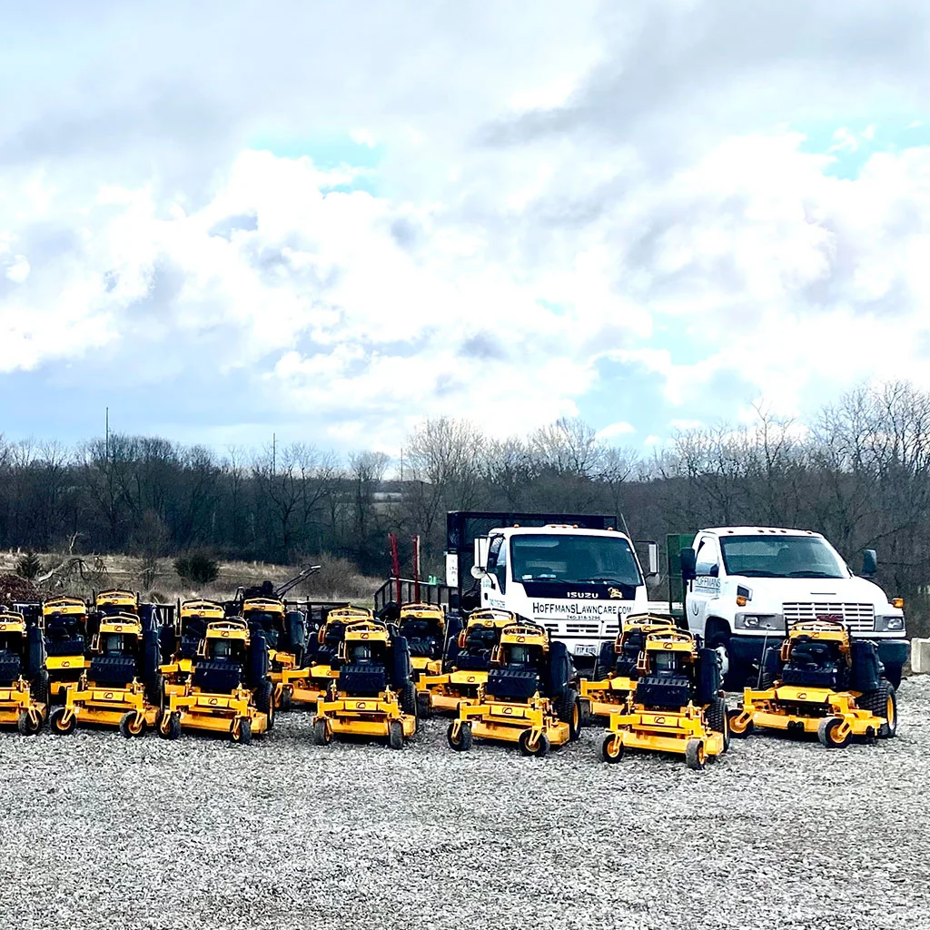 Mowing equipment lined up by work trucks in Delaware, OH.