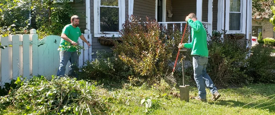 Crew cleaning up debris in a yard in Delaware, OH.