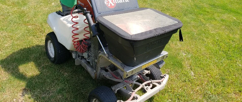 Fertilizer spreader machine on a lawn in Delaware, OH.