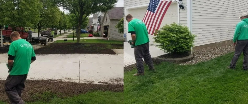 Worker in Delaware, OH, applying mulch ground cover in landscape bed.