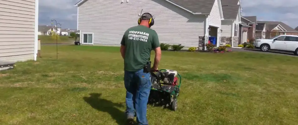 Lawn care crew aerating a lawn in Delaware, OH.
