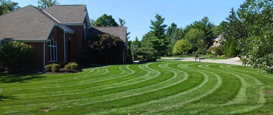 House in Genoa Township, OH, with a neatly mowed lawn.