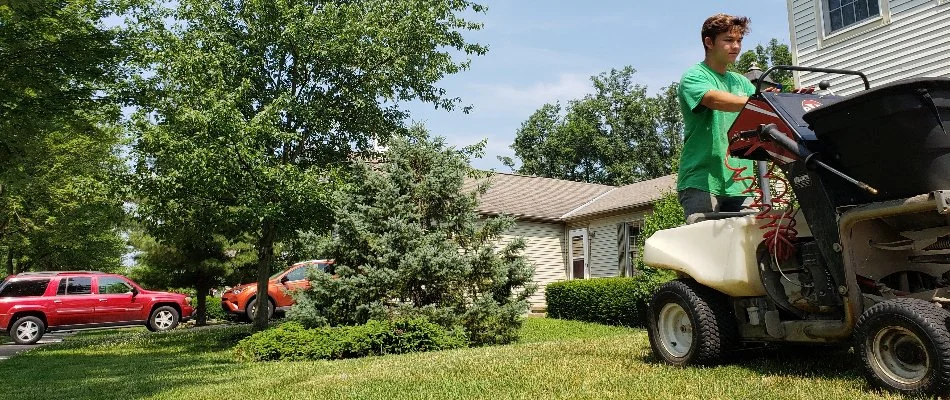 Man on a fertilizer spreader machine in Norwich Township, OH.