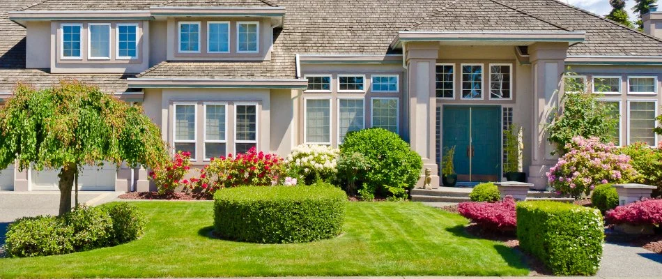Manicured yard in Berkshire Township, OH, with neat shrubs and colorful flowers.